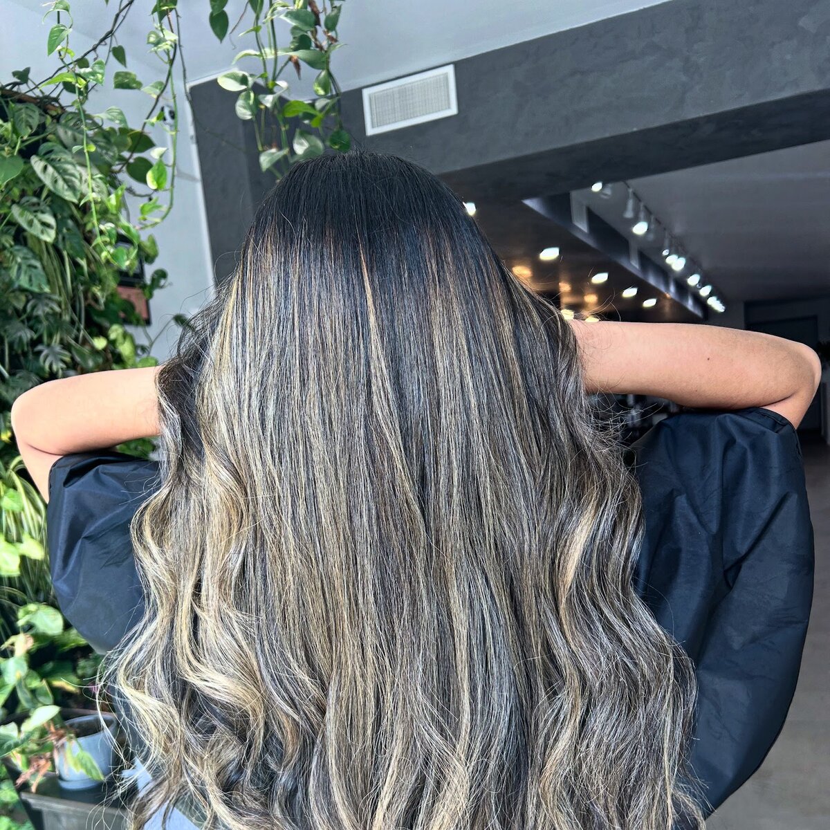 Balayage on brunette curls at Luxe Hair Lounge Brooklyn